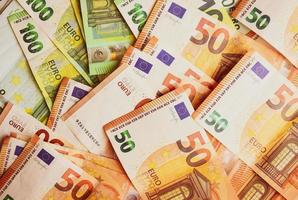 Euro Money Banknotes background texture. Fifty and one hundred banknotes only. photo