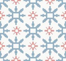 Christmas knitted seamless pattern with blue and red snowflakes. vector