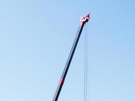 Crane on a blue sky background. photo