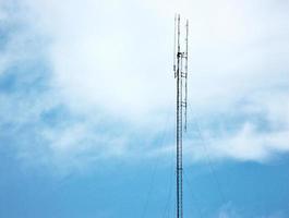 High column radio transmitter on the sky background photo