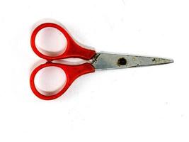 Baby scissors have bright colors on white background. photo