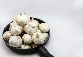 Garlic mass with  pan on White Background.