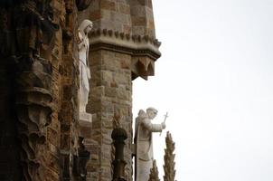 figures on tower of cathedral in Barcelona photo