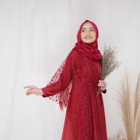 Beautiful islamic female model wearing hijab fashion, a modern lifestyle outfit for muslim woman. Concept a wedding dress, beauty or eidul fitri. A asian girl model wearing hijab on indoor photoshoot photo