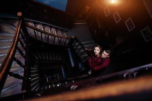 couple of young people on the wooden stairs photo