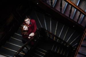 couple of young people on the wooden stairs photo