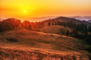 Fantastic sunny hills glowing by sunlight. Carpathian, Ukraine, photo