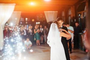 Happy bride and groom a their first dance, wedding photo