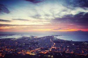 Sunset over the city from on high. photo