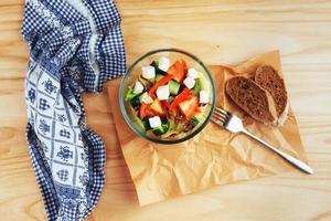 Greek salad with fresh vegetables, feta cheese and olives photo