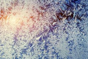 Frosty natural pattern on winter window photo