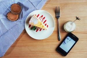 triangle cheese cakes in cafe. On a wooden table photo