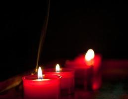 Votive candles lit in the church photo