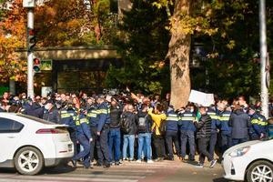 Tbilisi, Georgia, 2022 - Police officers and protestors in street photo