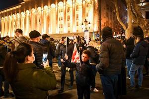 Tbilisi, Georgia, 2022 - young boy pose for photo is protest