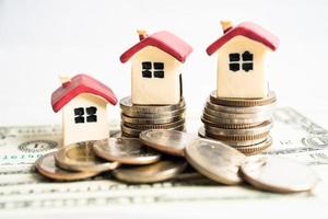 House on stack coins, mortgage home loan finance concept. photo