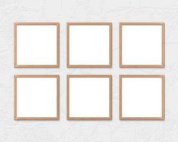 Set of 6 square wooden frames mockup hanging on the wall. Empty base for picture or text. 3D rendering. photo