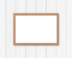 Horizontal wooden frames mockup hanging on the wall. Empty base for picture or text. 3D rendering. photo