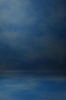 Photo studio portrait backdrop. Background painted scratch texture dark blue, cloud sky with spot light. 3D rendering
