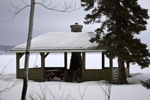 Picnic shelter at Waskesui Lake in winter photo