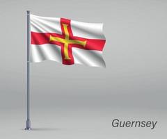 bandera ondeante de guernsey - territorio del reino unido en flagpol vector