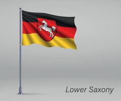 Waving flag of Lower Saxony - state of Germany on flagpole. Temp vector