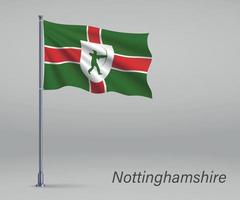 Waving flag of Nottinghamshire - county of England on flagpole. vector