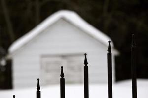 Gate of a cemetery in winter photo