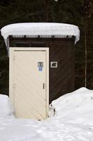 Outhouse at Waskesui Lake in winter photo