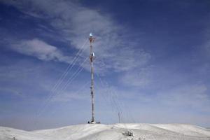 Microwave tower on a winter day photo