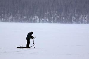 Ice fisherman on Waskesiu Lake photo