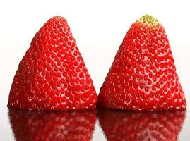 Strawberries reflected reflected on glass photo