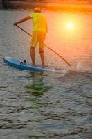 Milan Italy 2018 Paddler in a dock at sunset photo