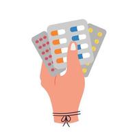 Hand holds medicinal pills in blister packs vector