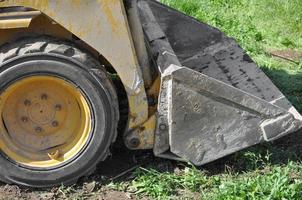 Excavator digging a hole photo