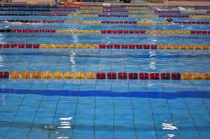 A swimming pool with blue water waves photo