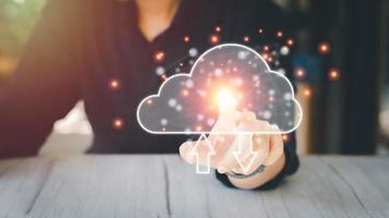 Cloud data storage concept. Finger-pointing to cloud computing with transfer arrow. Communication of business and financial. Large database and synchronize with the internet and technology. photo