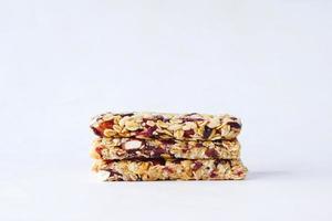 Almond , Raisin and oat protein bars on table photo