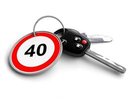 Car keys with speed limit on key ring. Concept for speeding and dangerous driving. photo