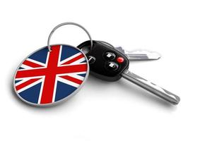 Set of car keys with keyring and country flag. photo