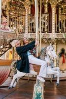 portrait of senior woman with daughter spending nice time together at amusement park. Lockdown is over, family, relationships, care, life after vaccination, having fun with family concept photo