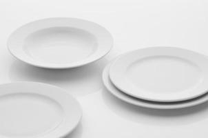 kitchen and restaurant utensils, plates, on a light background photo