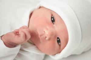 face baby in a white hat photo