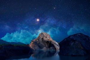 high mountains with stars at night photo