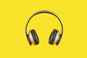 A wireless headphone in a yellow background photo