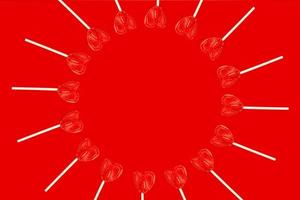 several heart shaped lollipops placed side by side forming a circle on a red background. photo