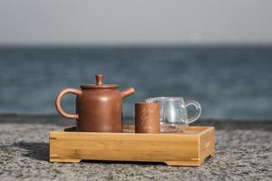 Yixing Clay Teapot. Chinese Tea Ceremony. Spring sea Background