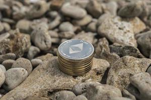 ethereum Cryptocurrency. e-currency. summer beach. sea stones photo