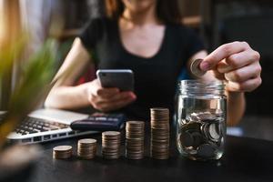 Business accountant working on desk using mobile phone and calculator to calculate budget concept finance and accounting photo