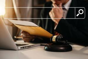Searching Browsing Internet Data Information Networking Concept with blank search bar.justice and law concept.Male judge in a courtroom with the gavel,working photo